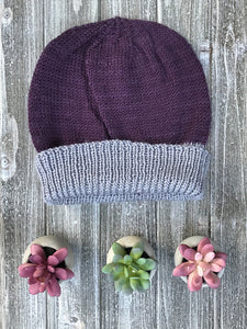 Knitted Sample of toque in purple and grey. Shown without pompom