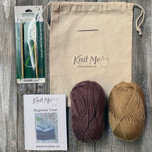 Beginner Cowl kit contents: mustard and brown yarn, pattern, knitting needles, wool needle, work in progress bag 