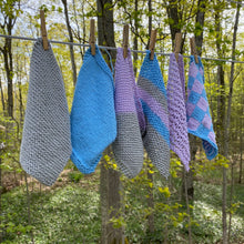 Load image into Gallery viewer, set of the knitted dishcloths hanging on a clothes line