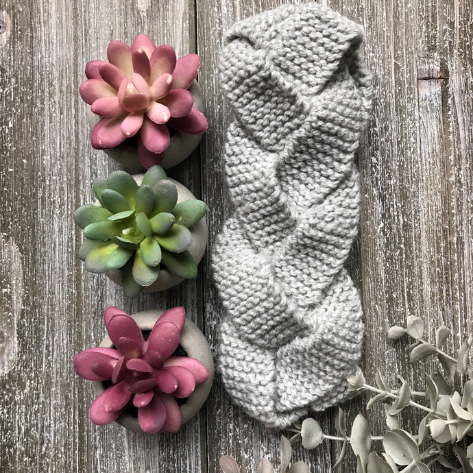 Knitted sample of braided headband in grey